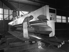Steelworker at Park Gate Iron and Steel Co, Rotherham, South Yorkshire, April 1964. Creator: Michael Walters