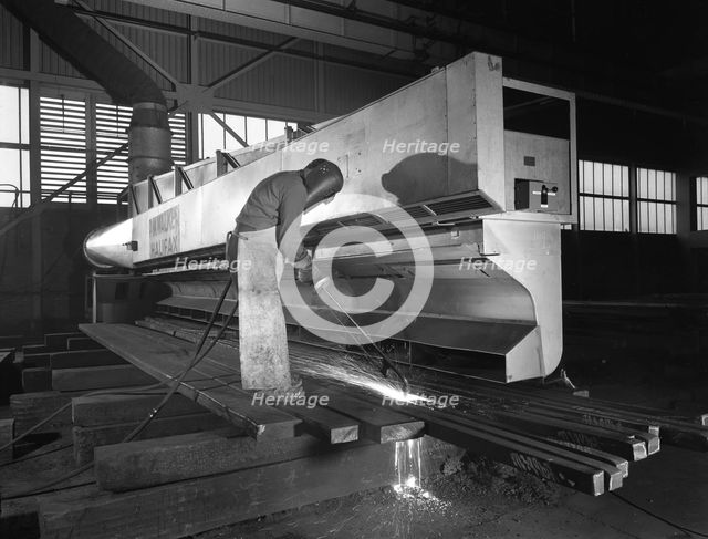 Steelworker at Park Gate Iron and Steel Co, Rotherham, South Yorkshire, April 1964.  Creator: Michael Walters.