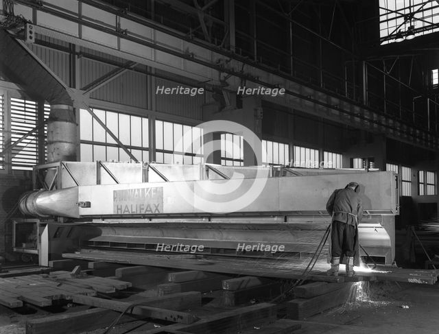 Steelworker at Park Gate Iron and Steel Co, Rotherham, South Yorkshire, April 1964.  Creator: Michael Walters.