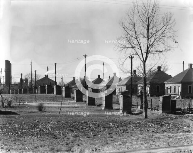 Steelmill workers' company houses and outhouses, Republic Steel Company, Birmingham, Alabama, 1936. Creator: Walker Evans.