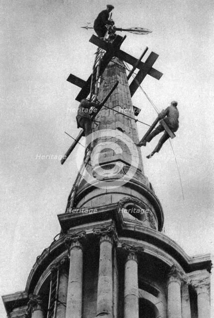 Steeplejacks on the spire of All Saints Church, Poplar, London, 1926-1927. Artist: Unknown