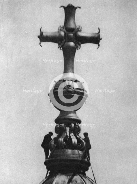 Steeplejacks on the summit of St Paul's Cathedral, London, 1926-1927. Artist: Unknown