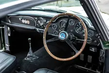 Steering wheel and dashboard of a 1961 Aston Martin DB4 GT previously owned by Donald Campbell. Creator: Unknown