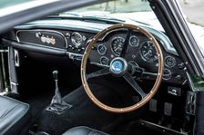 Steering wheel and dashboard of a 1961 Aston Martin DB4 GT previously owned by Donald Campbell. Creator: Unknown