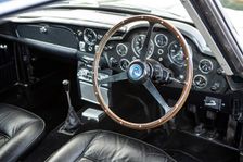 Steering wheel and dashboard of a 1965 Aston Martin DB5. Creator: Unknown