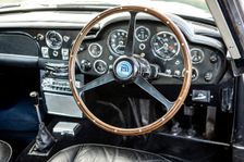 Steering wheel and dashboard of a 1965 Aston Martin DB5. Creator: Unknown