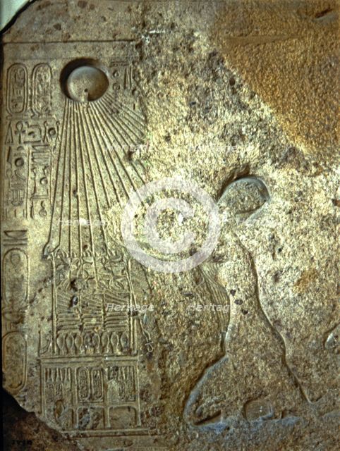 Stela depicting Akhenaten, Nefertiti and their daughters adoring Aton, made in limestone.