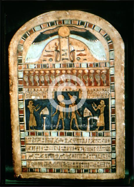 Stela in wood representing the deceased Ba-s-Turefi before the god Atum and Ra-Haharchte, from Th…