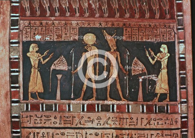 Stela in wood representing the deceased Ba-s-Turefi before the god Atum and Ra-Haharchte, from Th…