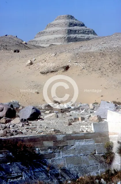 Step Pyramid of King Djoser (Zozer) behind ruins of temple, Saqqara, Egypt, c2600 BC. Artist: Imhotep