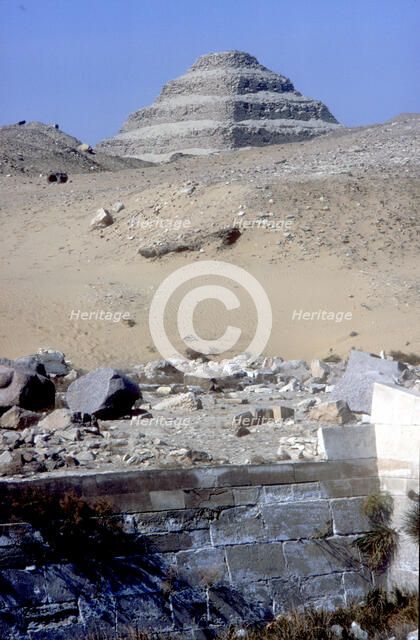 Step Pyramid of King Djoser (Zozer) behind ruins of temple, Saqqara, Egypt, c2600 BC. Artist: Imhotep