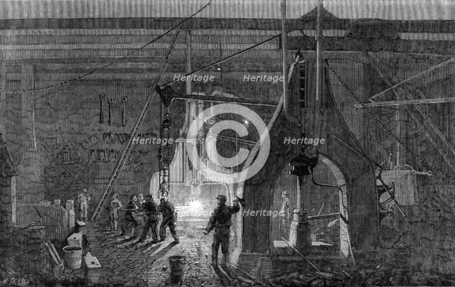 Stephenson's locomotive manufactory at Newcastle-On-Tyne: the steam-hammer, 1864. Creator: Mason Jackson.