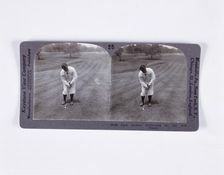 Stereoscopic card showing Bobby Jones addressing the ball for a mashie pitch, c1900
