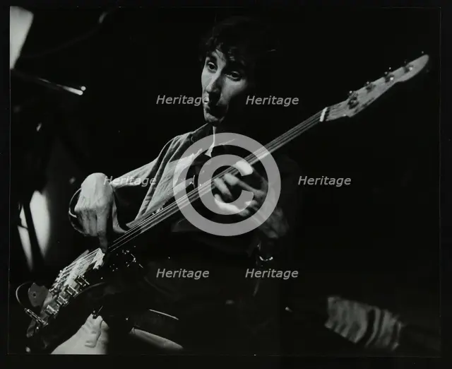 Steve Cook playing bass guitar at The Stables, Wavendon, Buckinghamshire. Creator: Denis Williams.