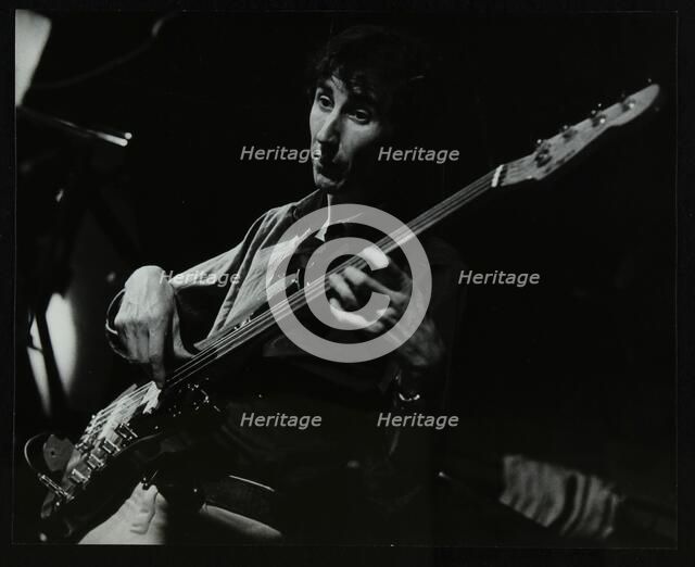 Steve Cook playing bass guitar at The Stables, Wavendon, Buckinghamshire. Artist: Denis Williams