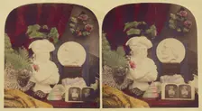 Still life of a bust, stereograph, flowers, and a medallion of Giuseppe (?), about 1860. Creator: Unknown