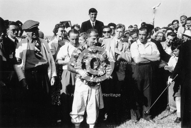 Stirling Moss, winner of the British Grand Prix, Aintree, 1955. Artist: Unknown