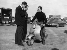 Stirling Moss on a Vespa scooter, Goodwood, April 1952