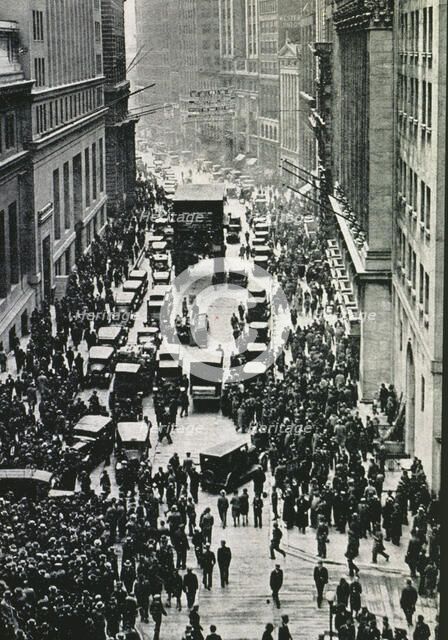Stock market crash of 1929 in New York, people expecting on the sidewalks of Wall Street in front…