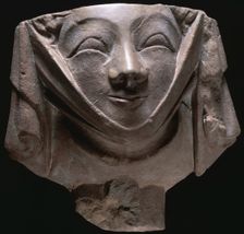 Stone corbel in the shape of a smiling nun, medieval, 14th century. Creator: Unknown