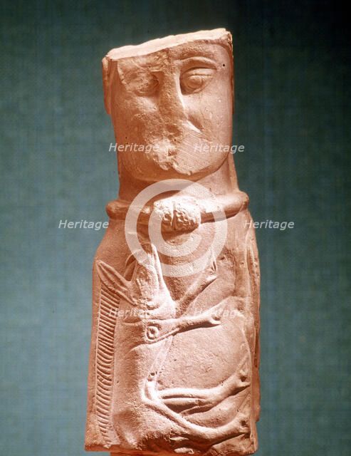 Stone carving of Celtic deity wearing a torque. Artist: Unknown
