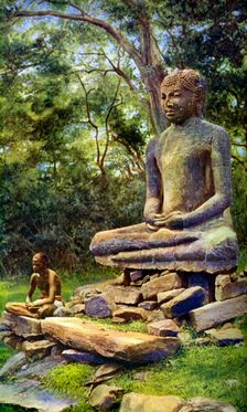Stone Buddha, a relic of the past glory of Anuradhapura, Ceylon, c1924