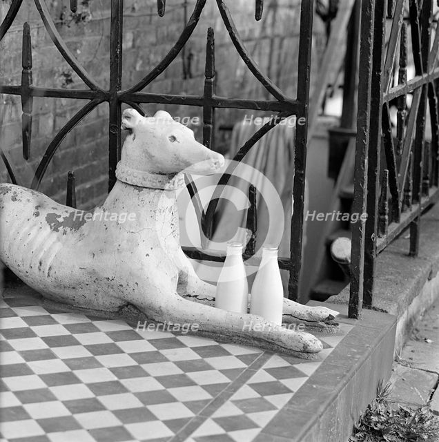 Stone greyhound and milk bottles, Duncan Terrace, Islington, London, 1962-1964. Artist: John Gay
