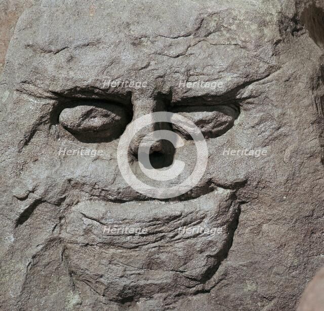 Stone head from a pagan Celtic shrine. Artist: Unknown