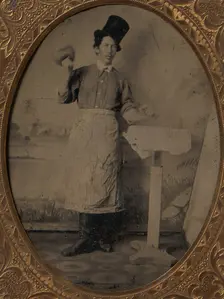 Stone Mason in Top Hat and Apron with Mallet and Chisel, 1870s-80s. Creator: Unknown