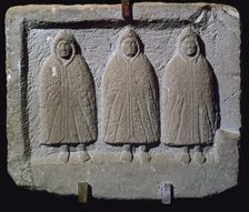 Stone relief of a trio of hooded Romano-British deities, 3rd century