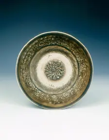 Stoneware bowl with moulded peony scroll and lions, Jin dynasty, China, 13th century. Creator: Unknown