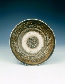 Stoneware bowl with moulded peony scroll and lions, Jin dynasty, China, 13th century. Creator: Unknown