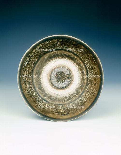 Stoneware bowl with moulded peony scroll and lions, Jin dynasty, China, 13th century. Creator: Unknown.