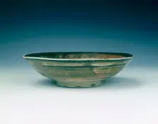 Stoneware bowl with moulded peony scroll and lions, Jin dynasty, China, 13th century. Creator: Unknown
