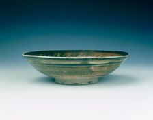 Stoneware bowl with moulded peony scroll and lions, Jin dynasty, China, 13th century. Creator: Unknown