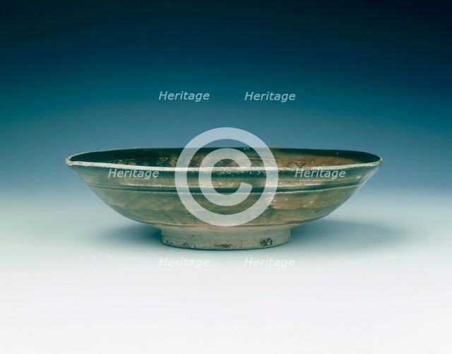 Stoneware bowl with moulded peony scroll and lions, Jin dynasty, China, 13th century. Creator: Unknown.