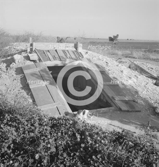 Storage cellar, typical of area, Dead Ox Flat, Malheur County, Oregon, 1939. Creator: Dorothea Lange.
