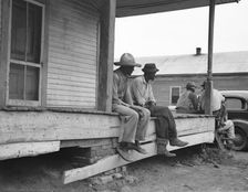 Storefront loafers, Mississippi Delta, 1936. Creator: Dorothea Lange