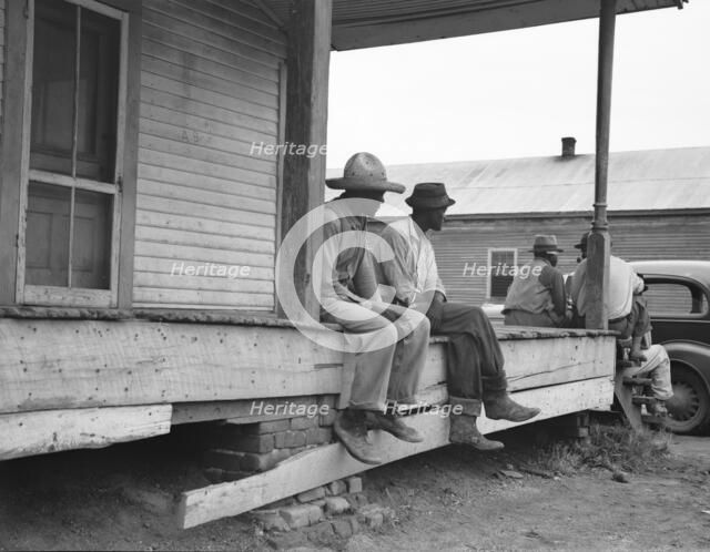 Storefront loafers, Mississippi Delta, 1936. Creator: Dorothea Lange.