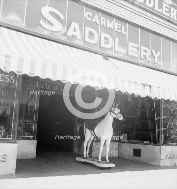 Storefront of San Joaquin Valley town, Fresno, on U.S. 99, California, 1939. Creator: Dorothea Lange.