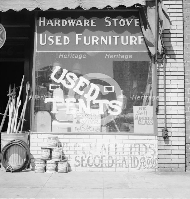 Storefront of San Joaquin Valley town, Fresno, on U.S. 99, California, 1939. Creator: Dorothea Lange.