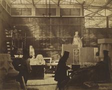 [Storeroom with Artisans and Plaster Casts, Crystal Palace], 1852. Creator: Philip Henry Delamotte