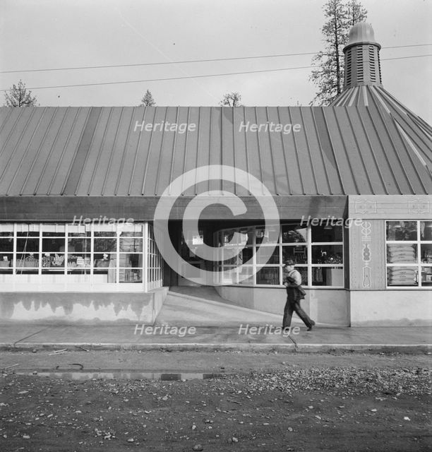 Stores and community center in model lumber company town, Gilchrist, Oregon, 1939. Creator: Dorothea Lange.