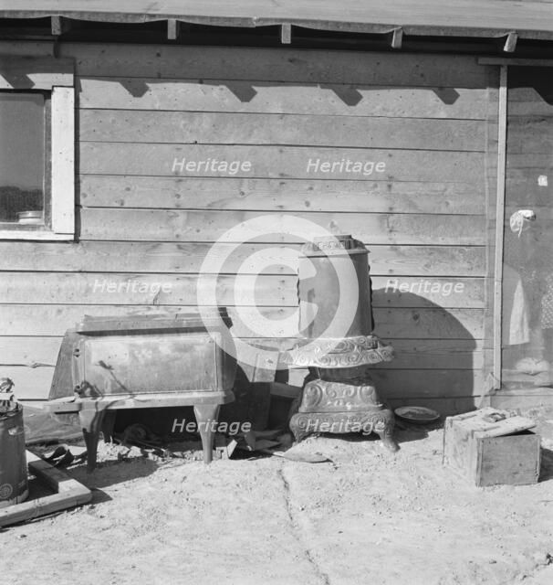 Stoves outside the Browning house being repaired for winter use, Dead Ox Flat, Oregon, 1939. Creator: Dorothea Lange.