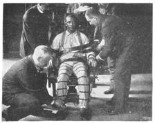 Strapping the Victim into the Death Chair United States, 1898. Creator: Unknown