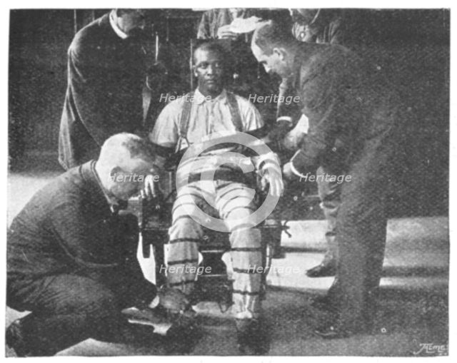 'Strapping the Victim into the Death Chair', United States, 1898. Creator: Unknown.