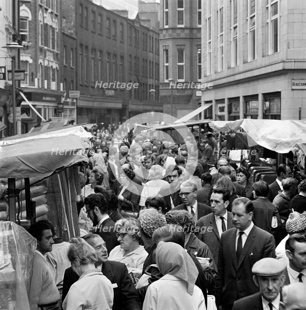Street market at Leather Lane, Holborn, London, 1960s. Artist: John Gay