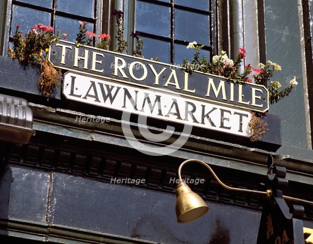 Street name sign in the Royal Mile, Edinburgh, Scotland. Creator: Peter Thompson.