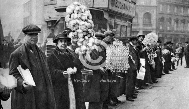 Street hawkers selling football favours in Walham Green, London, 1926-1927. Artist: Unknown