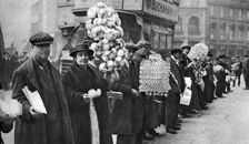 Street hawkers selling football favours in Walham Green, London, 1926-1927